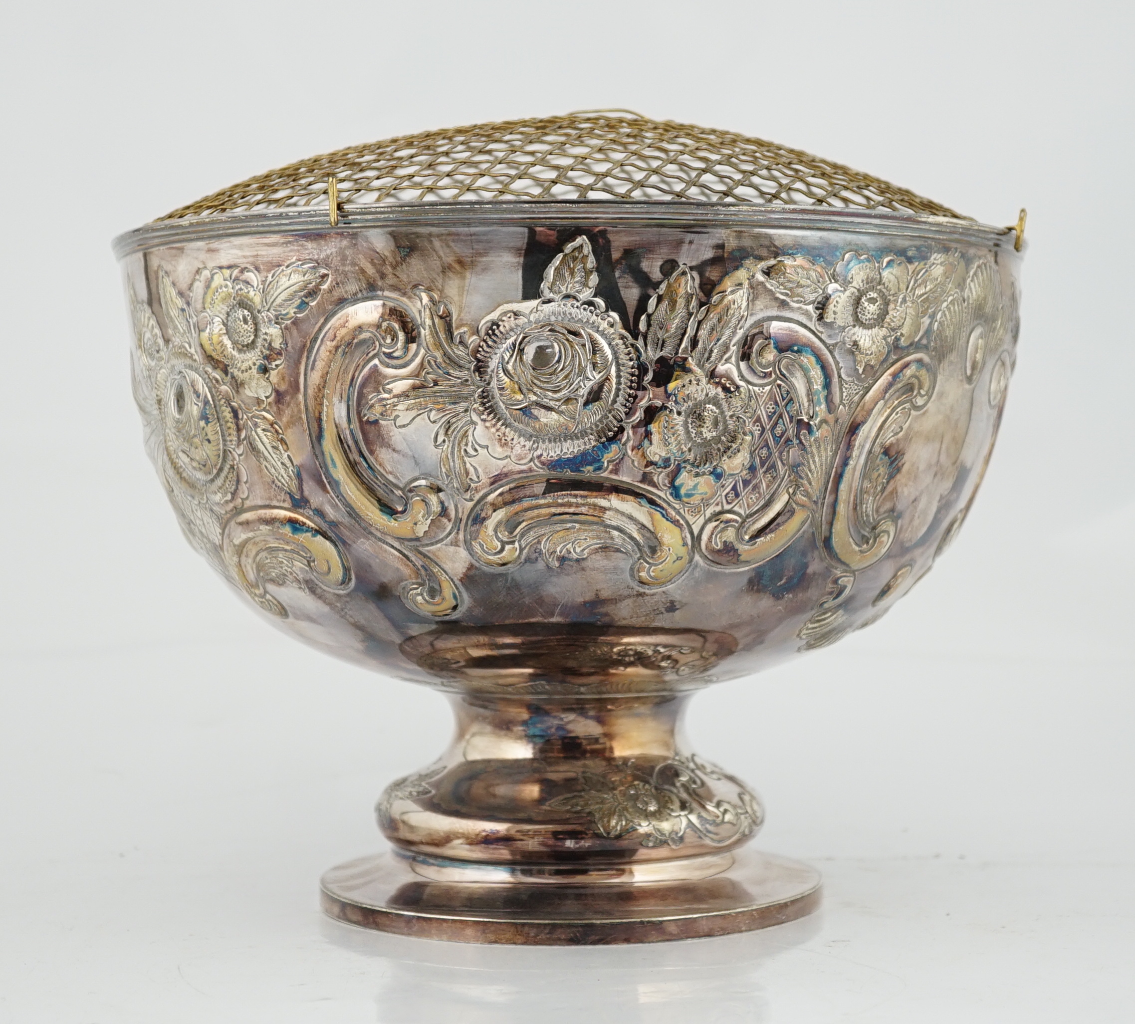 A large Edwardian repousse silver rose bowl, by Carrington & Co